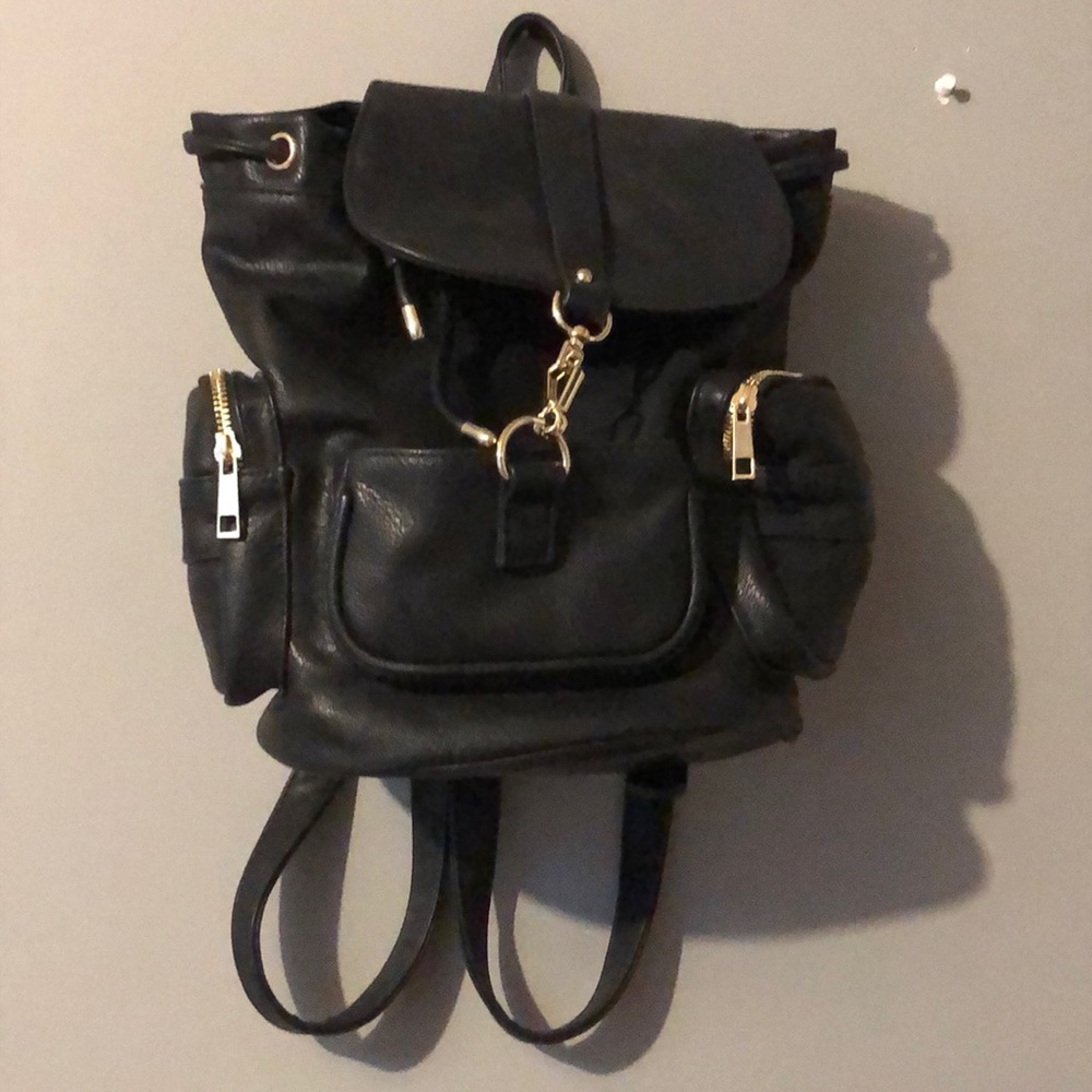 Black faux leather backpack with gold